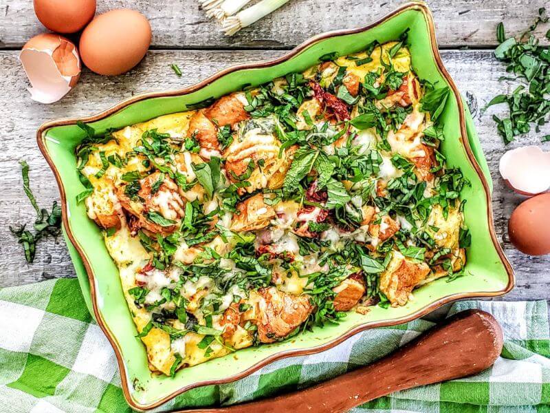 Charmaine Broughton Blog - Mother's Day Brunch Recipes - Croissant Pudding with Fresh Herbs and Aged Cheddar - image of recipe in green baking dish